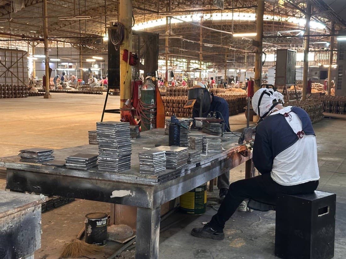 Prior plant work — fabrication benches and plate stacks on the San Simon factory floor (not a Calma.Basic product)
