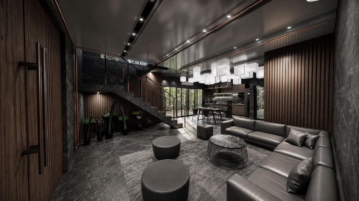 Calma.Basic black-skin open living — charcoal stone, wood slats, cube lanterns, forest glazing