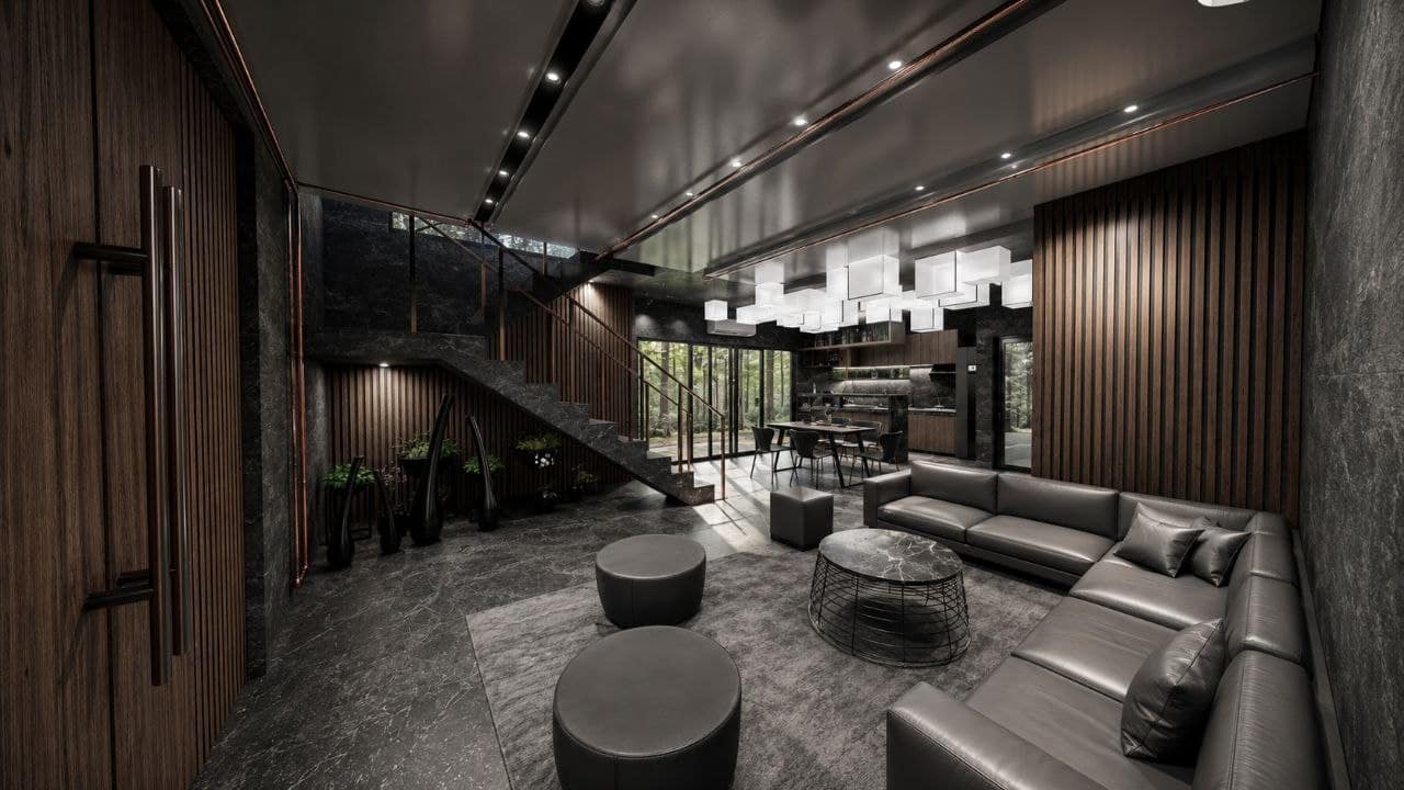 Calma.Basic black-skin open living — charcoal stone, wood slats, cube lanterns, forest glazing