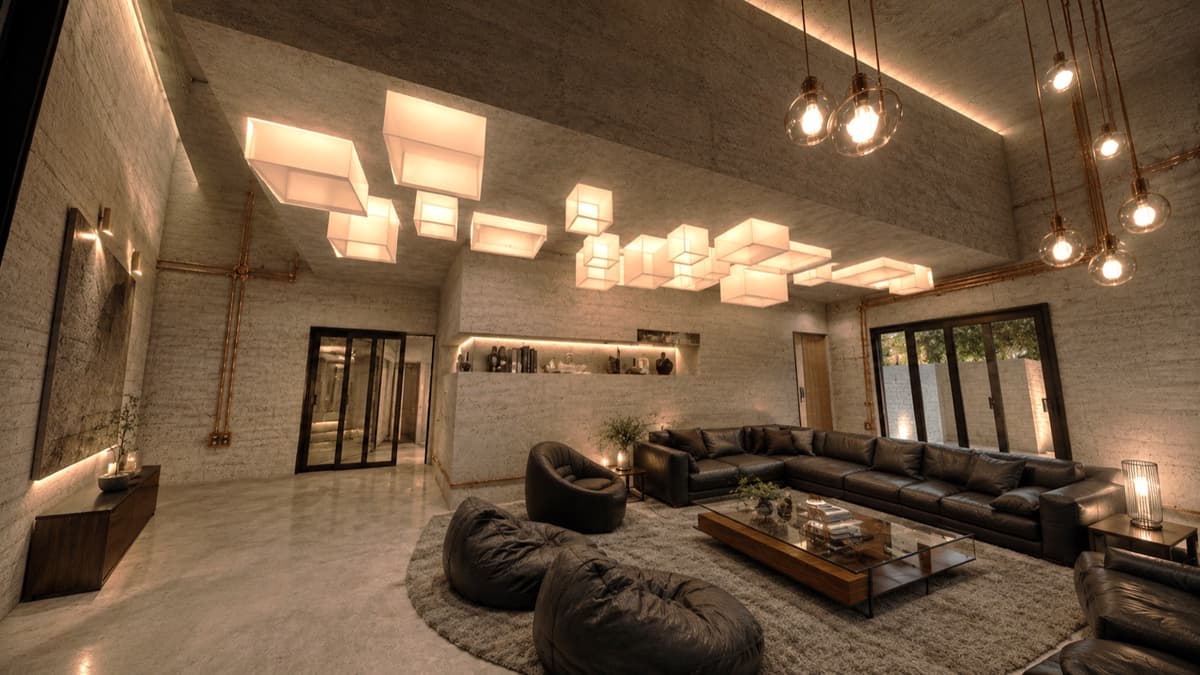 Calma.Basic lounge with globe pendants, concrete shell, and copper conduits — five-star hotel fit-out